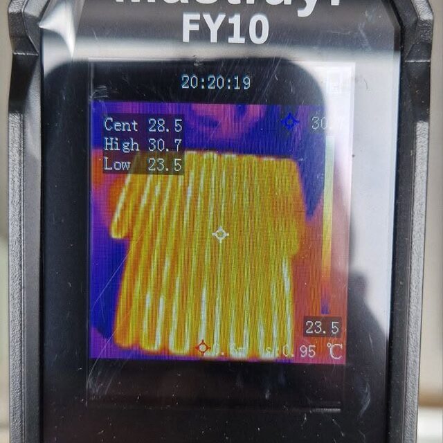 Thermal imaging camera showing the heat pattern of newly installed underfloor heating pipe loops warming evenly across the floor, tested by Downs Plumbing & Heating
